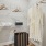 Walk in closet with a hanging robe and shelving
