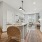Kitchen with two barstools and tableware