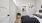 Bedroom with bed and framed pictures on the wall