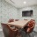 Conference room table with chairs and a mounted television