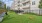 Fenced in grass area with a ramp